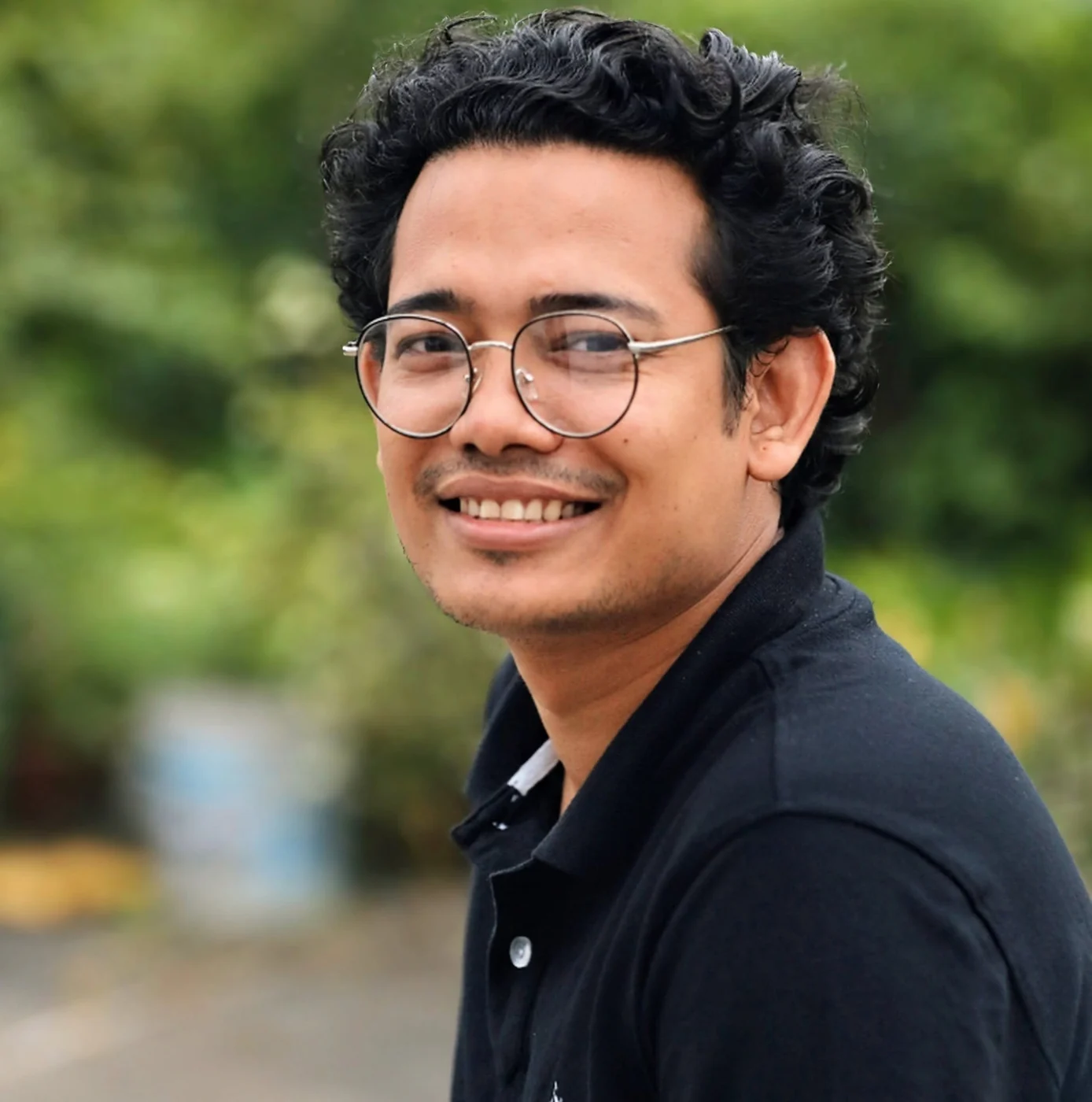 Arafat Rahaman smiling outdoors